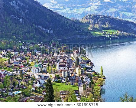 View Of Lake Lucerne Or Vierwaldstaetersee With Vitznau Settlement And Swiss Alps In The Background 