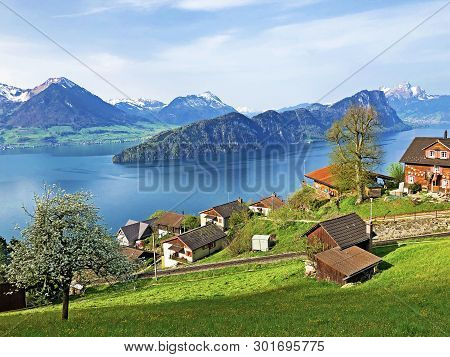 View Of Lake Lucerne Or Vierwaldstaetersee With Vitznau Settlement And Swiss Alps In The Background 