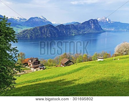 View Of Lake Lucerne Or Vierwaldstaetersee With Vitznau Settlement And Swiss Alps In The Background 