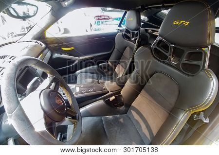 Russia, Moscow - May 04, 2019: Interior Of Yellow Porsche Cayman Gt4. Racing Car In The Dealer Showr