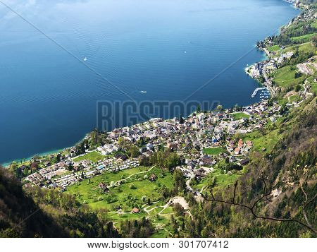 View Of The Vitznau Settlement On The Shore Of Lake Lucerne Or Vierwaldstaetersee From The Top Of Vi
