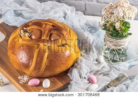 Portuguese Traditional Easter Cake. Folar With Eggs On Wooden Table