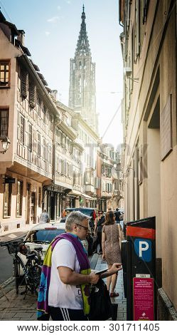 Strasbourg, France - Jul 22, 2017: Man Paying For Parking In Cetral Strasbourg At The Parking Meter 