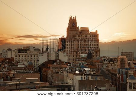 MADRID, SPAIN - MAY 13, 2018: Telefonica Building rise above historical buildings on Gran Via business district.