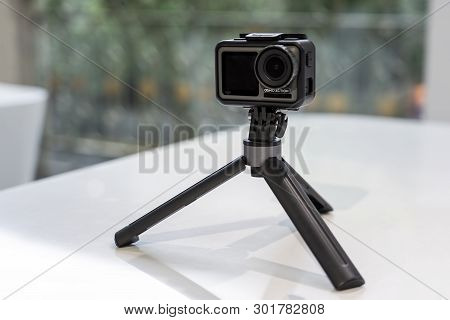 China, Shanghai - May 18, 2019. Dji Osmo Action In Protected Case And Tripod.