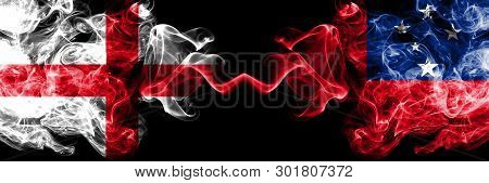 English Vs Samoa, Samoan Smoky Mystic Flags Placed Side By Side. Thick Colored Silky Smokes Flag Of 