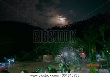 Clouds Covering The Moon Partly Over Jhalong Village At Night, Image Shot At Dooars - North Of West 