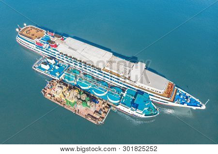 Refueling At Sea - Small Oil Products Ship Fuelling A Large Bulk Carrier, Aerial Image.