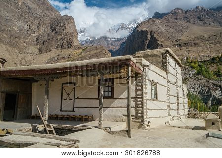 Baltit Fort In Karimabad, Hunza Valley. Unesco World Heritage Site With A View Of Clouds Covered Sno