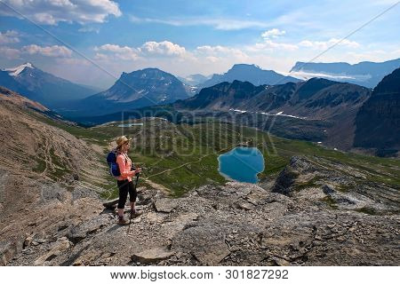 Middle Age Woman Hiking In Canadian Rockies. Active Vacation In Banff National Park. Alberta. Canada