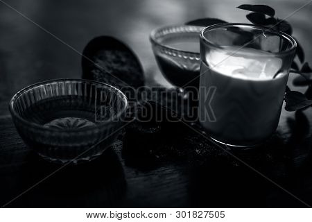 Face Mask Of Devil's Dung Powder On Wooden Surface I.e. Hing Powder Well Mixed With Honey And Milk.u