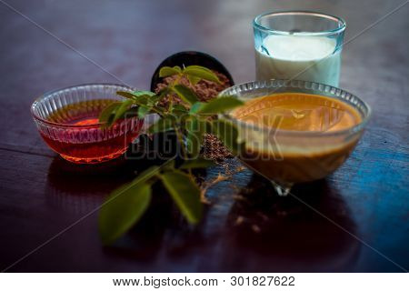 Face Mask Of Devil's Dung Powder On Wooden Surface I.e. Hing Powder Well Mixed With Honey And Milk.u