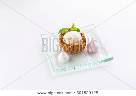 Vanilla Ice Cream With Meringe And Mint In A Wafer Bowl Isolated On White Background Side View