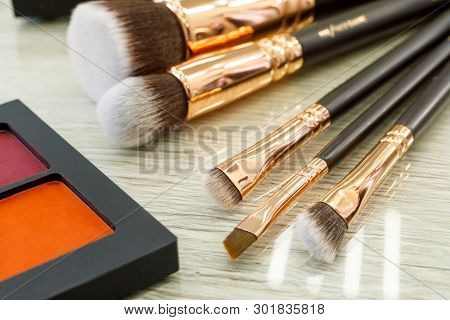 Palette With Shadows And Brushes On The Table In The Beauty Salon