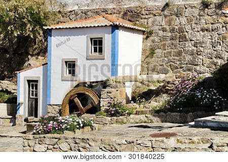 Beautiful And Colorful Waterwheel In Azenhas Do Mar In Lisbon, Portugal. Name Of The Village ,azenha