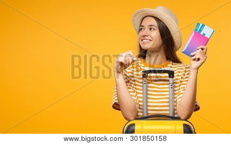 European Caucaian Female Dressed In Summer Clothes Sitting At Suitcase With Airplane Tickets Dreamin