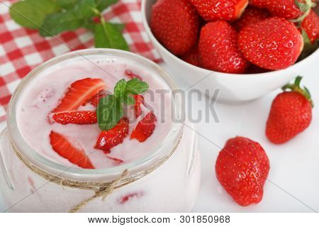 Strawberries And Joghurt In A Jar. Fresh Organic Greek Yogurt With Strawberries.