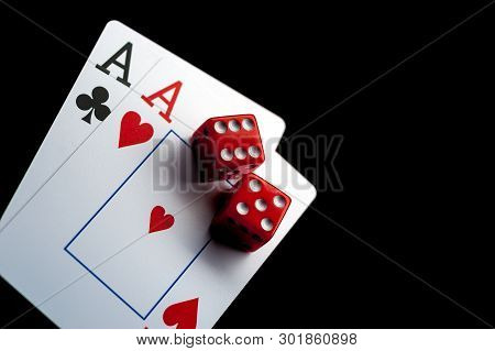 Close-up - Two Aces, Playing Cards And Red Gaming Dices On Black Table. Casino, Gambling Game Chance
