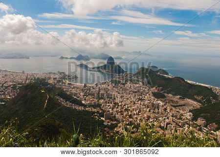 Rio De Janeiro, Sugar Loaf, Brazil: Mountain Resembling Inverted Funnel Behind Urca Hill. Tourist Si