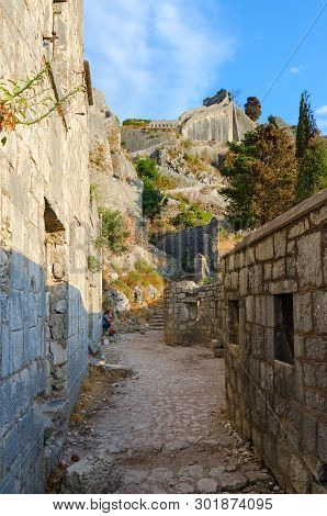 Kotor, Montenegro - September 8, 2017: Unknown Tourists Visit Ruins Of Ancient Fortress Above City O