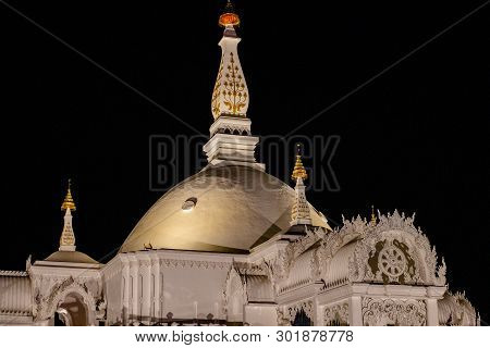 Architecture Of Wat Bunglatthiwan In Ayutthaya, Thailand On Vesak Day With Colour Light Decor Around