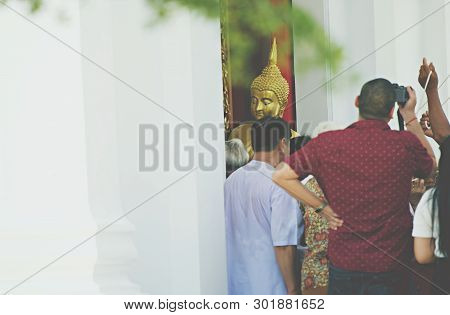 Lopburi, Thailand - 18 May 2019 - Thai Buddhist Hold The Big Buddha Statue And Someone Hold Fired Ca