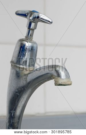 Limescale. Close-up Of Hard Water Calcium Carbonate Deposit On Faucet Tap. Selective Focus Close Up 