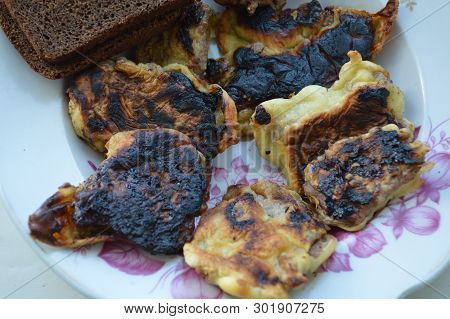 Fried Meat In A Pan With Breading