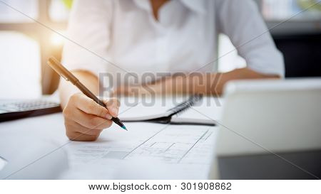 Engineer Designer Women. Drawing And Planning With Blueprint Architecture On Desk Office. Drafting A