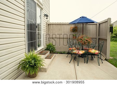 Outdoor Condo Dining Area with Boston Ferns