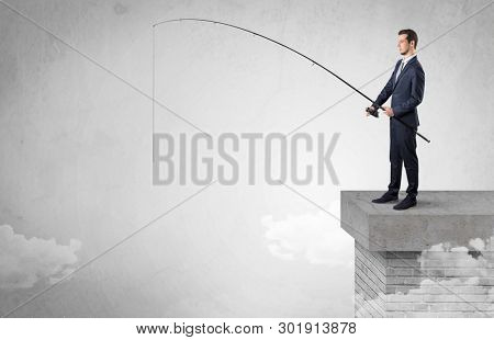 Businessman fishing nothing from the cloud with free copyspace