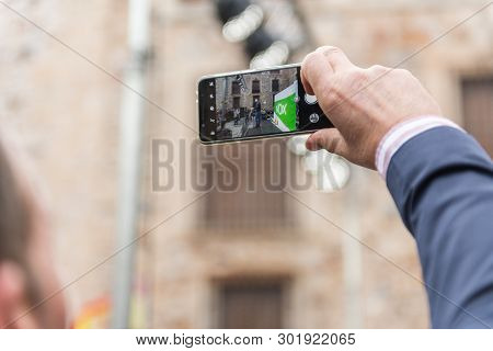 Caceres, Extremadura, Spain - May  18, 2019:  A Man Takes A Photograph Of The Intervention Of The Le