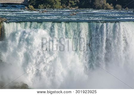 Gorgeous View Of Niagara Falls Landscape.waves Rumbling Against The Rocky Shore. Beautiful Nature Ba