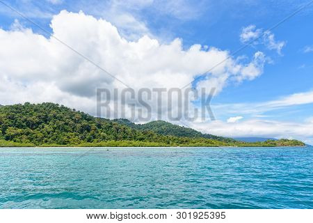 Beautiful Tropical Nature Landscape Of Clear Sea Near The Beach, Green Island, White Cloud And Blue 