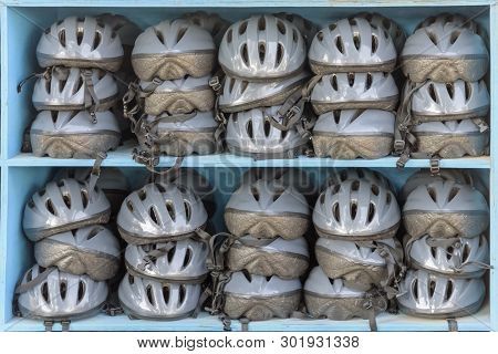 Many Cycling Helmets For Rent. Excursion, Tour In Park. Leisure Activities And Recreation In Agamon 