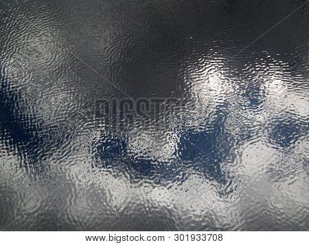 Background Of Mirror Reflection In The Water Of Blue Sky, Clouds, About The Trees Surrounding The Ri