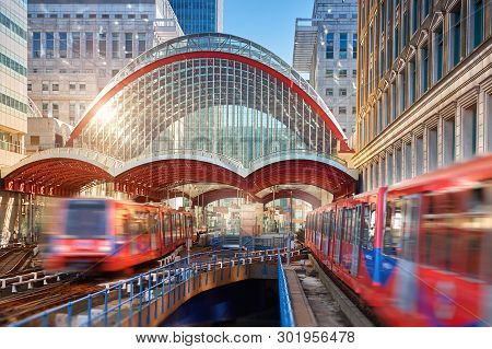 London, England - May 5, 2013: Canary Wharf, Dlr Station In London, Uk. Dlr Train Leaving The Statio