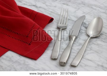 Beautiful Silverware On Linen Napkin