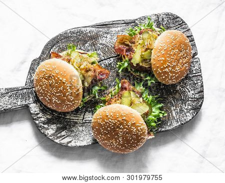 Classic Homemade Burger With Pork Cutlet, Bacon, Pickles, Fried Onions And Mayonnaise Mustard Sauce 