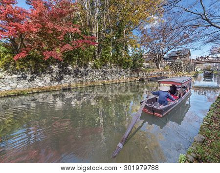 Tourist On Boat Sightseeing Around Hachiman-bori Canal In Omihachiman, Japan
