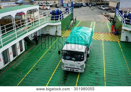 Labuan,malaysia-july 15,2016:a View Of Lorries On Board Of The Ro-ro Passenger Ship In Labuan,malays