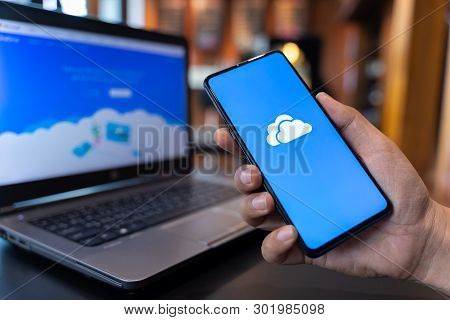 Chiang Mai, Thailand - May.01,2019: Man Holding Xiaomi Mi Mix 3 With Onedrive On Screen. Microsoft O