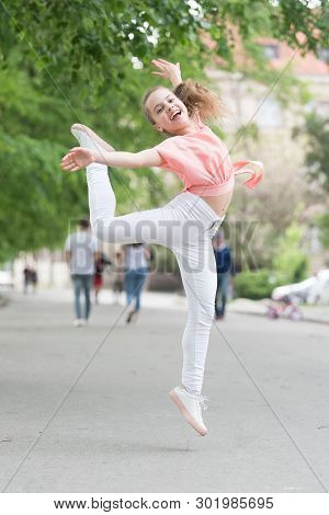 I Am Dancing Roll Up The Floor. Dancing Girl. Adorable Dancer Feeling Free On City Street. Small Chi
