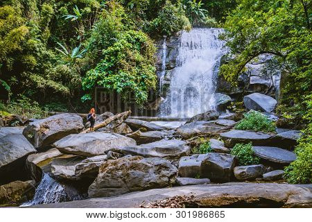 Women Travel. Woman Asia Travelers Travel Nature Forests, Mountains, Waterfalls. Travel Siliphum Wat