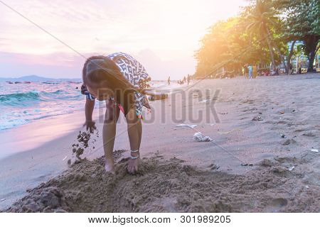 Two Siblings Children Is Playing With Wave And Sand In Pattaya Beach Thailand