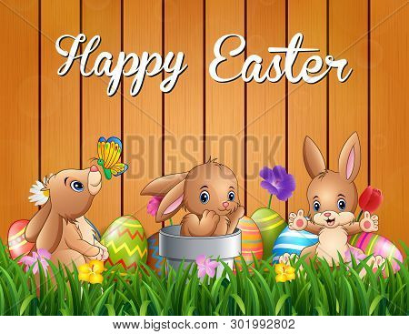 Happy Easter Bunnies On A Background Fence