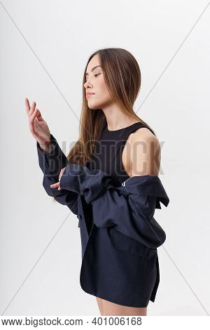 Portrait Of Young Attractive Asian Woman With Long Hair In Black Bodysuit And Blue Suit Isolated On 