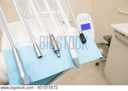 Interior Of The Dental Office With A Chair And Tools For Dental Treatment.