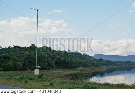 Pluviometer Or Rain Gauge In Mountain Background With Rain Cloud On Sky
