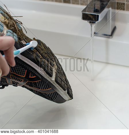 Washing The Dirty Sneakers. Cleaning Running Shoe Outsoles.